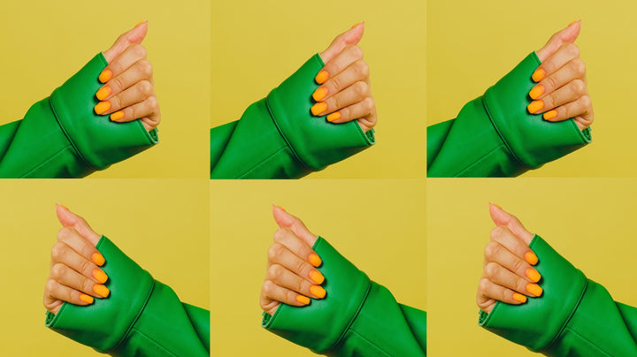 Several duplicate images in a collage of a person with a green sweater on, showing off their orange liberation nail polish color on their nails.