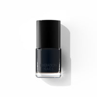 A bottle of Liberation Nails 21-free black nail polish named Blackbird.
