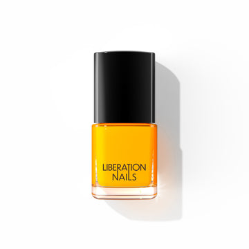 A bottle of Liberation Nails nail polish in a sunny yellow color, Golden Hour.