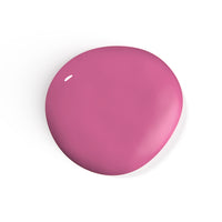 A droplet of Liberation Nails nail polish in a muted pink color, Joyful Heart.