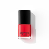 A bottle of Liberation Nails 21-free nail polish in a bold punchy red with a hint of orange color, Arrival