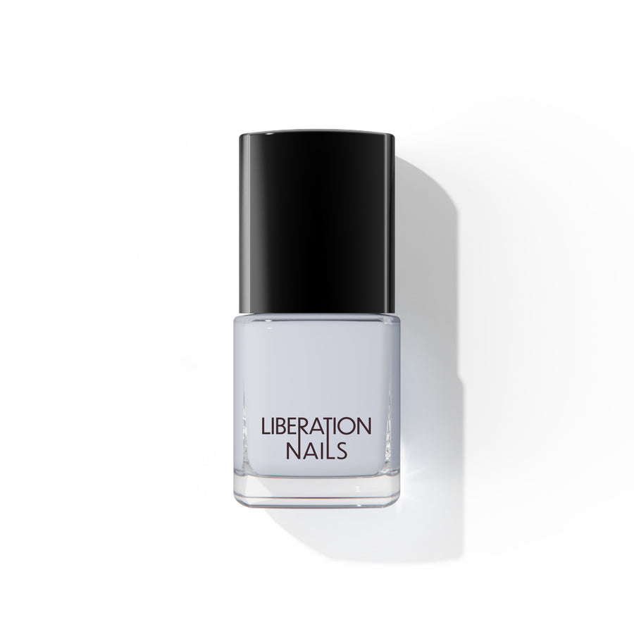 A bottle of Liberation Nails nail polish in a cool light gray color, Astrologic.