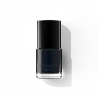A bottle of Liberation Nails 21-free nail polish in a classic black color, Blackbird.