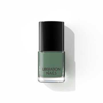 A bottle of Liberation Nails nail polish in a dark green color, Crowdfund