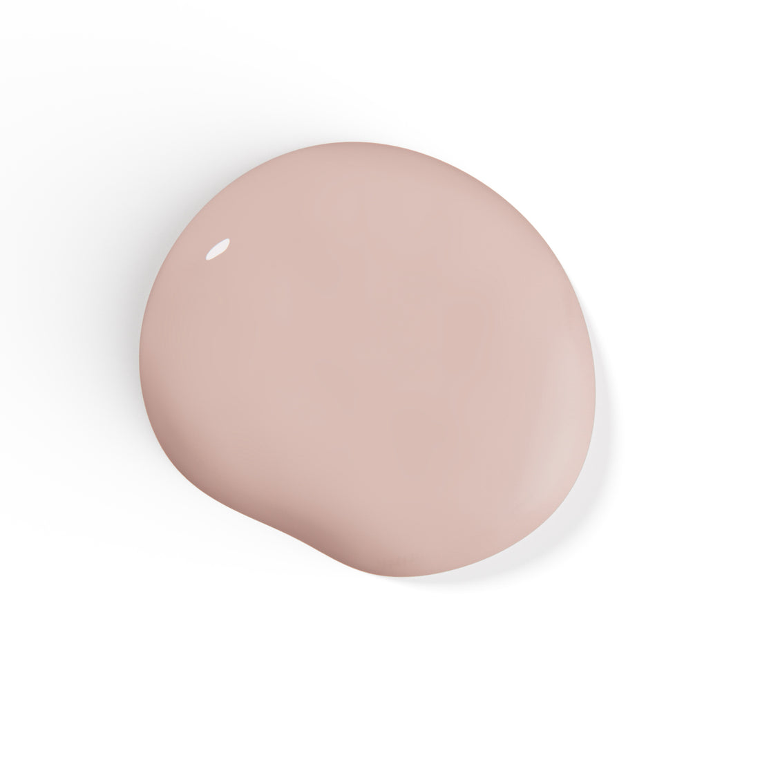 A droplet of Liberation Nails nail polish in a soft nude pink color, Darling.