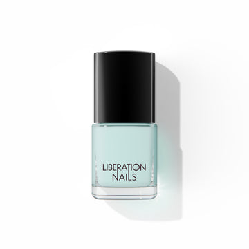 A bottle of Liberation Nails nail polish in a light minty blue color, Infinite Ceiling