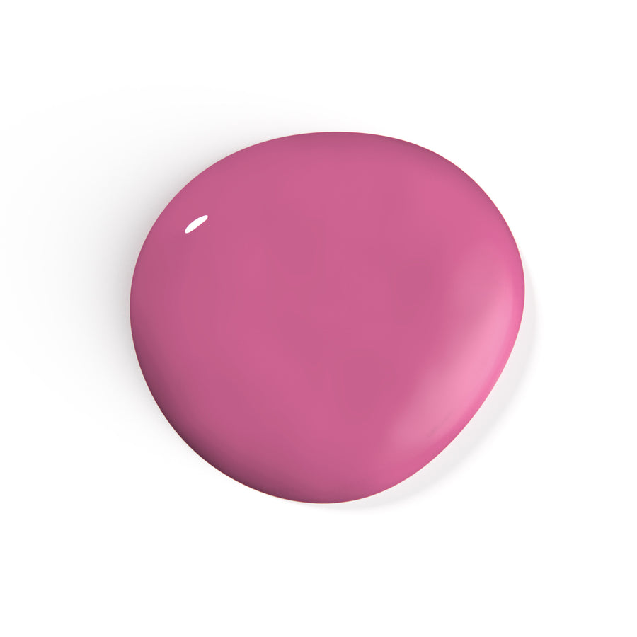 A droplet of Liberation Nails nail polish in a muted pink color, Joyful Heart.