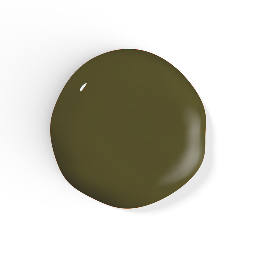 A droplet of Liberation Nails nail polish in a dark olive green color, Nature Bath.