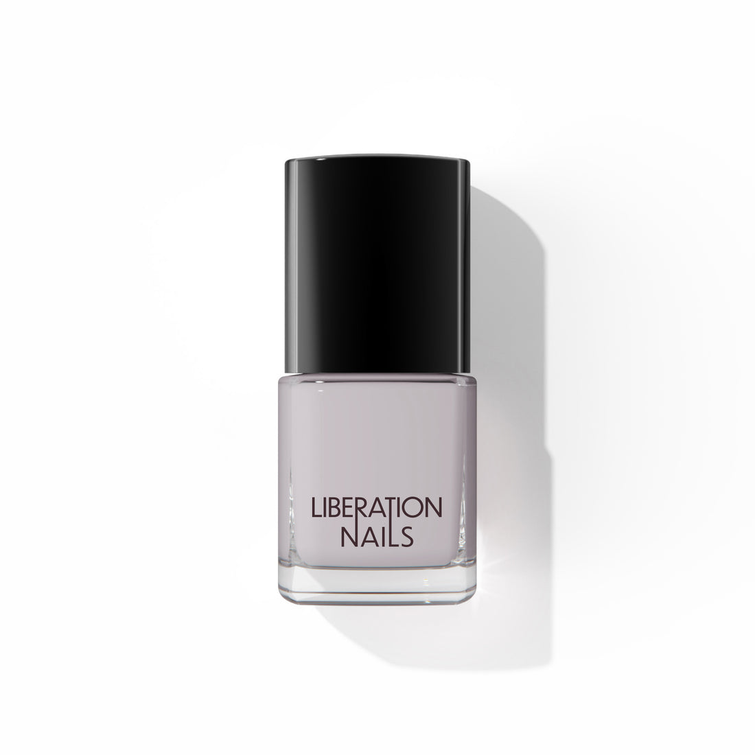 A bottle of Liberation Nails nail polish in a soft purple-y gray color, Seeker.