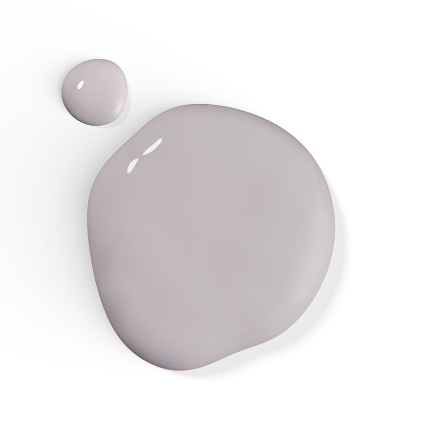 A droplet of Liberation Nails nail polish in a soft purple-y gray color, Seeker.