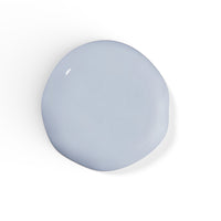 A droplet of Liberation Nails nail polish in a soft, cool gray color, Stormproof.